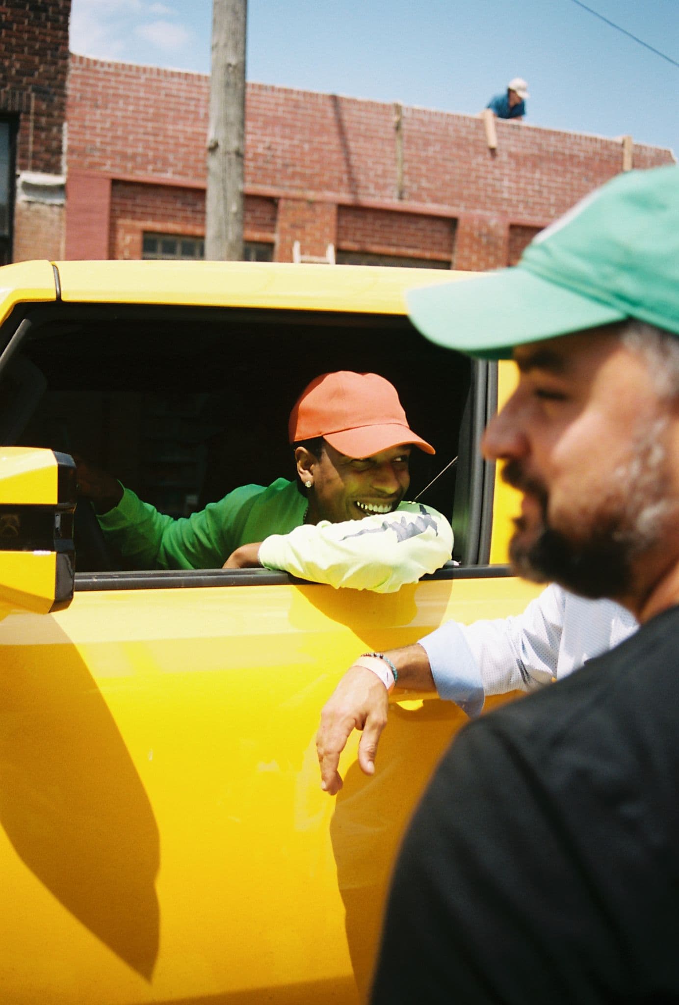 ASAP Rocky smiling from yellow car